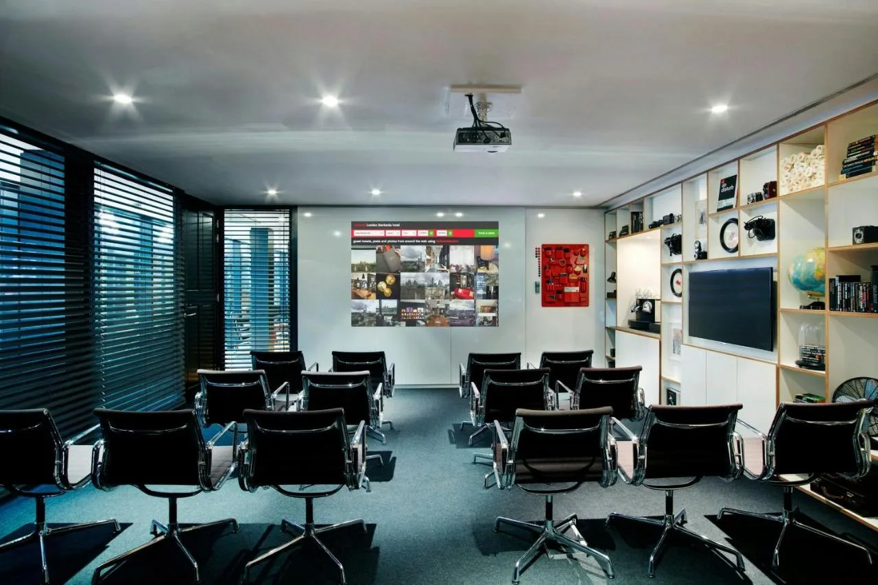a conference room with chairs in a room at citizenM London Bankside in London